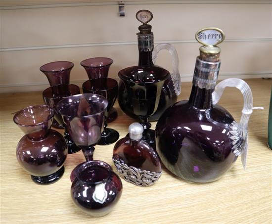 A group of 19th/20th century amethyst glass including a pair of decanters, height 22cm and six glasses